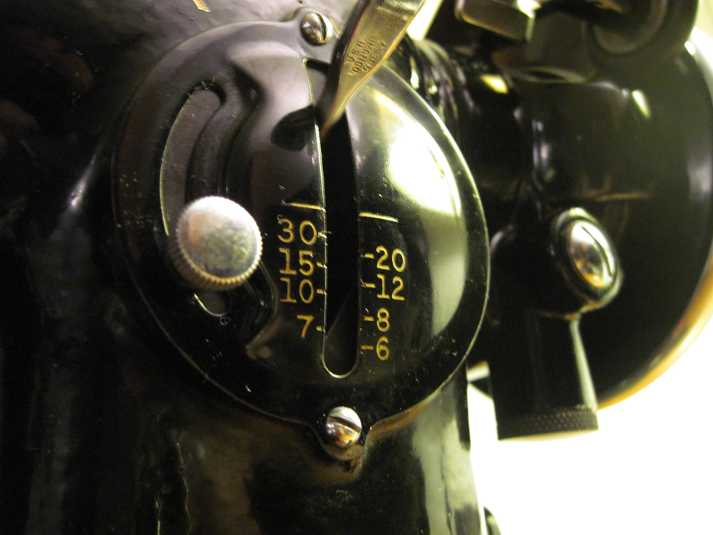 A closeup of the stitch regulator, numbered 30, 20, 15, 12, 10, 8, 7, and 6.