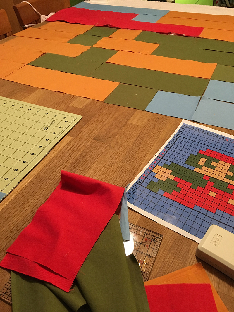 Mario's head is in the background, while a square-by-square plan is visible in the foreground.
