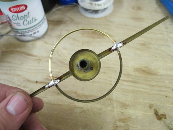 The repaired dial pointer.